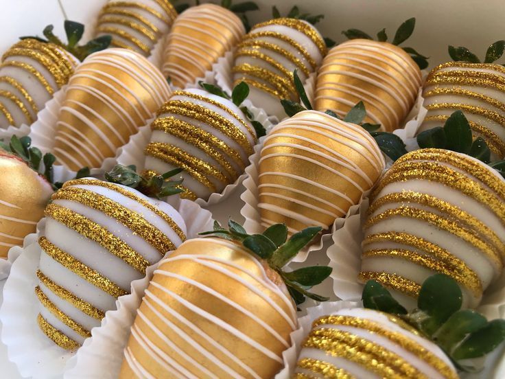 Strawberries covered in gold coating and drizzle